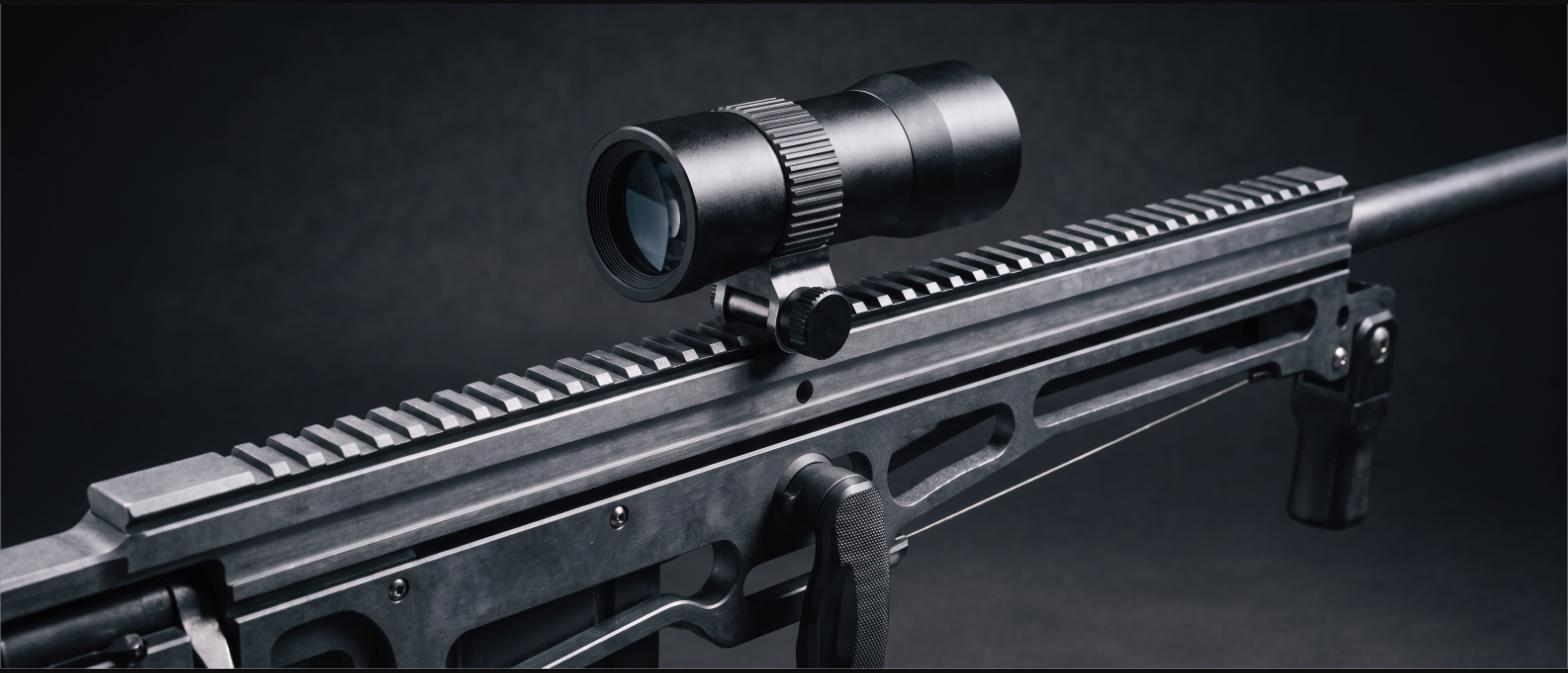 Close-up of a crossbow scope, rail and cocking mechanism